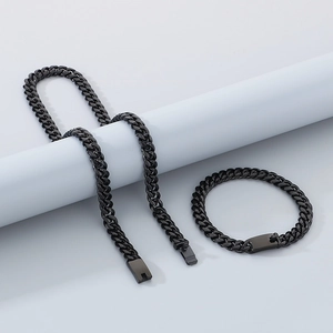Detail view of 8mm black polished stainless steel Cuban chain necklace and bracelet set