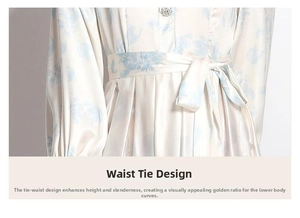 Detail of satin floral dress featuring a waist tie and elegant pleated textures