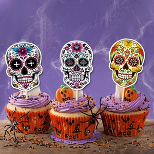 Calavera skull cake toppers on purple frosted cupcakes for Day of the Dead celebration