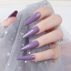 Detail of glossy bright purple extra long ballerina coffin nails with smooth UV finish