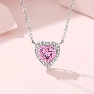 Macro shot of S925 silver necklace with pink heart gemstone and sparkling pavé setting