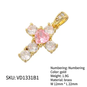 Luxury gold cross pendant with pink heart zircon and white stones on white background