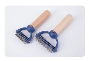 Macro detail of two pet grooming rakes with different tooth densities and wooden handles