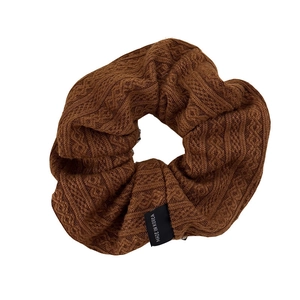 Brown cable knit hair scrunchie in French style with Made in Korea label on white background
