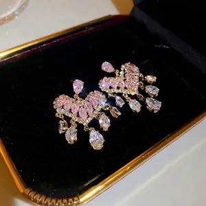 Exquisite gold heart fringe earrings with pink zircon and tassels in black jewelry box