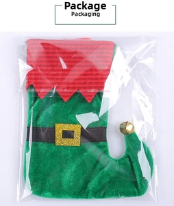 Macro detail of green elf boot Christmas stocking with belt buckle and gold bell in pack