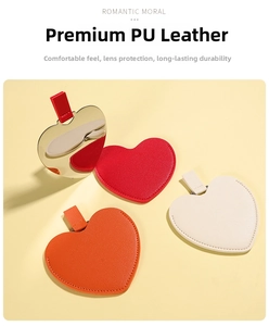 Detail view of heart-shaped stainless steel mirrors with premium PU leather cases