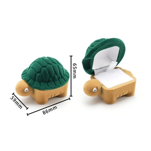 Green turtle-shaped velvet jewelry box showing open and closed detail with dimensions