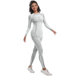 Detail of seamless knitted yoga set with functional white-gray textured compression patterns