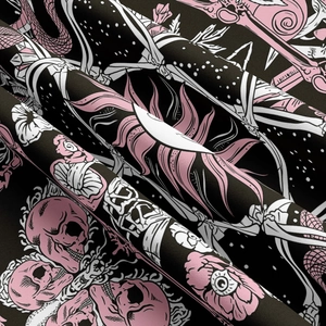 Close-up of gothic mushroom tapestry fabric showing pink skulls and soft texture