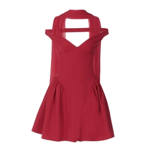 Detail of red V-neck party dress featuring neck streamer and sleeveless design