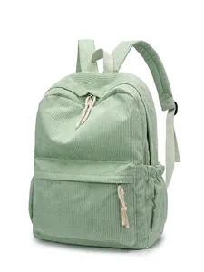 Light green corduroy backpack for students featuring multiple pockets and a top handle