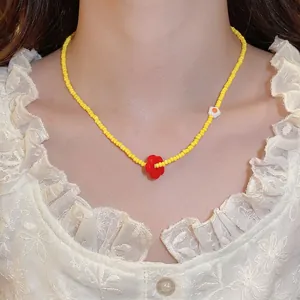 Beaded necklace with red flower pendant and yellow crystal cat eye beads for women