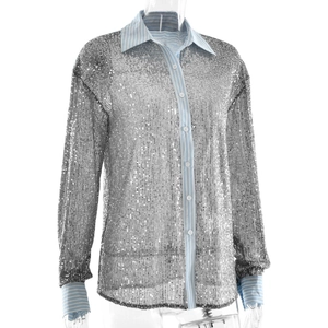 Detail of silver sequin shirt featuring blue and white striped trim on collar and cuffs