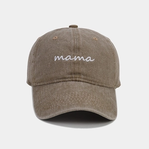 Detail of mama embroidery on a vintage washed brown denim baseball cap for women