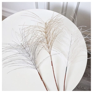 Macro detail of glittered SwanLace branches in silver, champagne gold, and white colors
