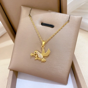 Elegant gold titanium steel necklace with a crystal-encrusted swallow holding a rose pendant