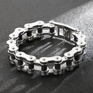 Macro shot of silver stainless steel bicycle chain bracelet with secure folding clasp