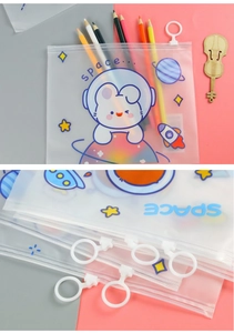 Detail of cute astronaut bunny pencil pouch featuring a round ring zipper and matte finish