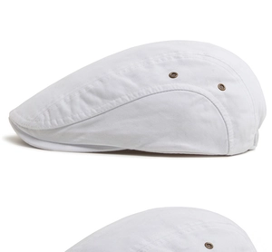 Detailed side view of white cotton beret featuring metal eyelets and premium stitching
