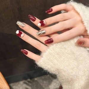 Festive velvet bow press-on nails set in deep wine red and champagne gold glitter
