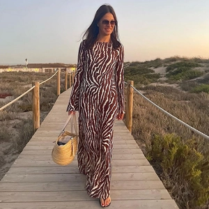 Close-up of zebra pattern long sleeve maxi dress with textured brown and white print