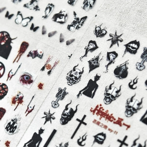 Dark gothic nail art stickers featuring skulls and bats on a grey background