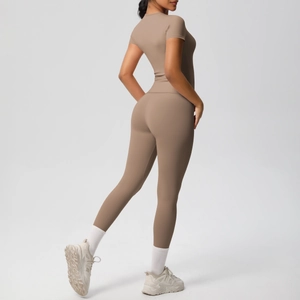 Rear view of light brown yoga set showing slimming cut and high-waist peach-lift leggings