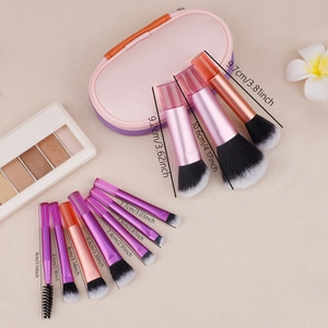 Flat lay of mini makeup brushes with size specs in cm and inches with pink storage case