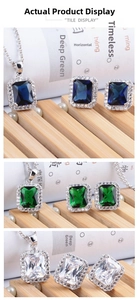 Detail of emerald-cut halo jewelry set with sapphire blue and emerald green stones