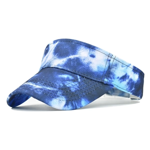 Detail of blue and white tie-dye sun visor hat with sporty curved brim and clean stitching