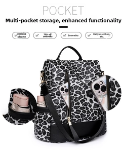 Detailed view of leopard print backpack showing multi-pocket storage and large capacity