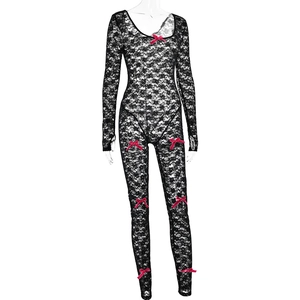 Close-up of black lace sheer jumpsuit featuring delicate pink bow accents and slim fit