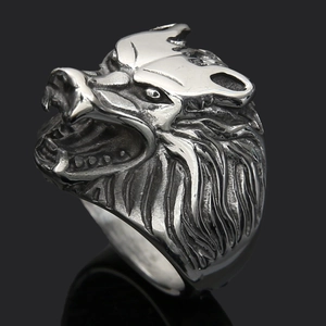Macro detail of retro silver wolf head ring showing intricate metal fur texture
