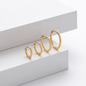 Set of four polished gold S925 sterling silver twisted hoop earrings in graduated sizes