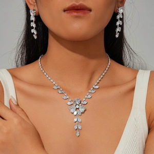 Exquisite silver necklace and earrings set featuring leaf and flower cubic zirconia stones