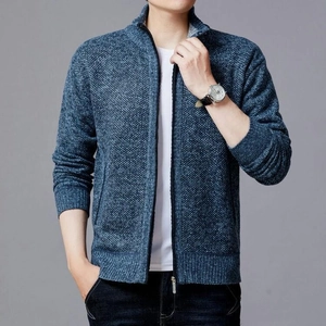Detail of blue knit cardigan with high collar, metal zipper, and textured fabric