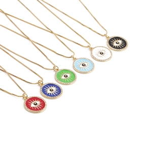 Detail view of colorful evil eye necklaces in red, blue, green, and white enamel finish