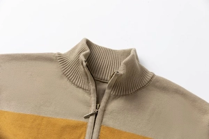 Detail of slim fit stand collar with zipper and khaki-yellow knitted texture