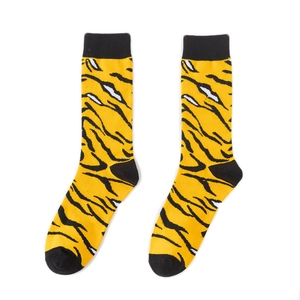 Detail of yellow cotton socks with tiger pattern texture and reinforced black toe