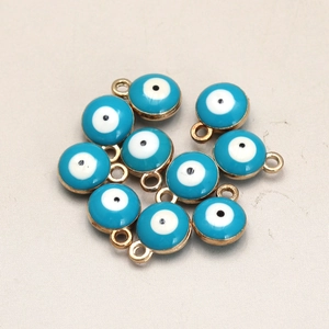 Detailed view of sky blue 8mm double-sided evil eye charms with golden plating for DIY jewelry