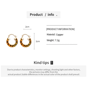 Detail view of 14k gold-plated leopard print hoop earrings with 2cm diameter measurements