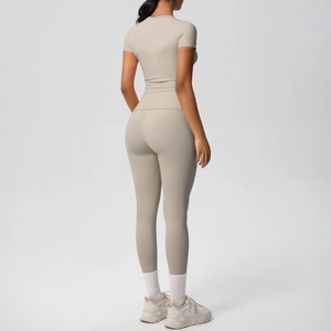 Detail of breathable brushed fabric on back of cream slim fit yoga top and leggings