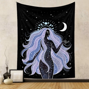 Detail of bohemian celestial goddess tapestry hanging in a modern home interior setup