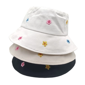 Cotton bucket hat with colorful flower embroidery in white, beige, and black colors