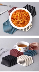 Close-up of geometric hexagonal hollow silicone coasters for heat insulation and non-slip