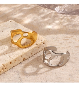 Irregular liquid metal style rings in gold and silver finish on beige stone