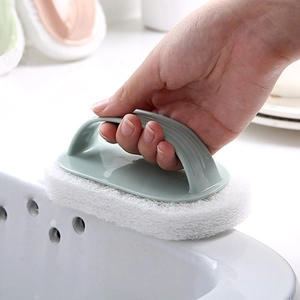 Ergonomic green handle sponge cleaning brush for kitchen sinks and bathroom tile floors