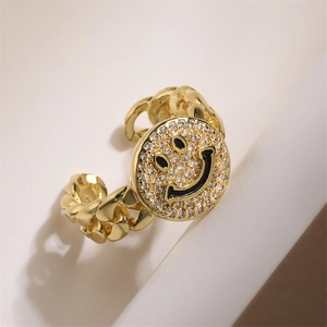 Detail of gold chain-style ring with a round micro-pave zircon smiley face design
