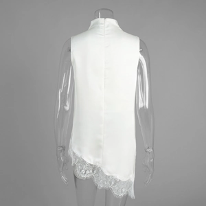 Detailed back view of white satin high-neck top with intricate lace hem and hidden zipper